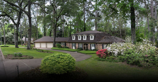 Home with gravel driveway & walking path