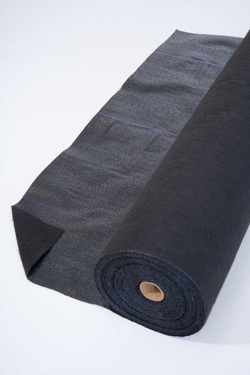 Image of a roll of heavy duty weed barrier from Howell Pathways.