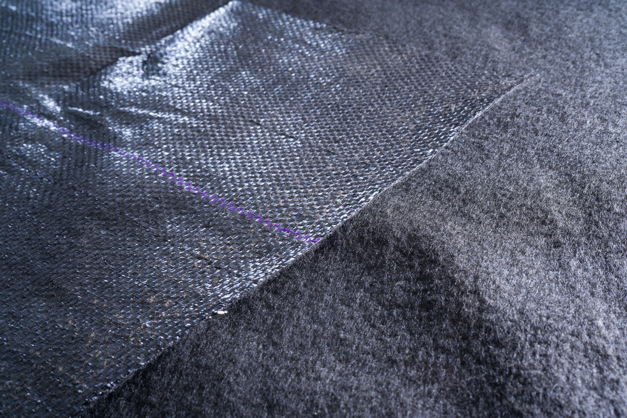 Image of a closeup of the heavy duty landscape weed barrier from Howell Pathways.