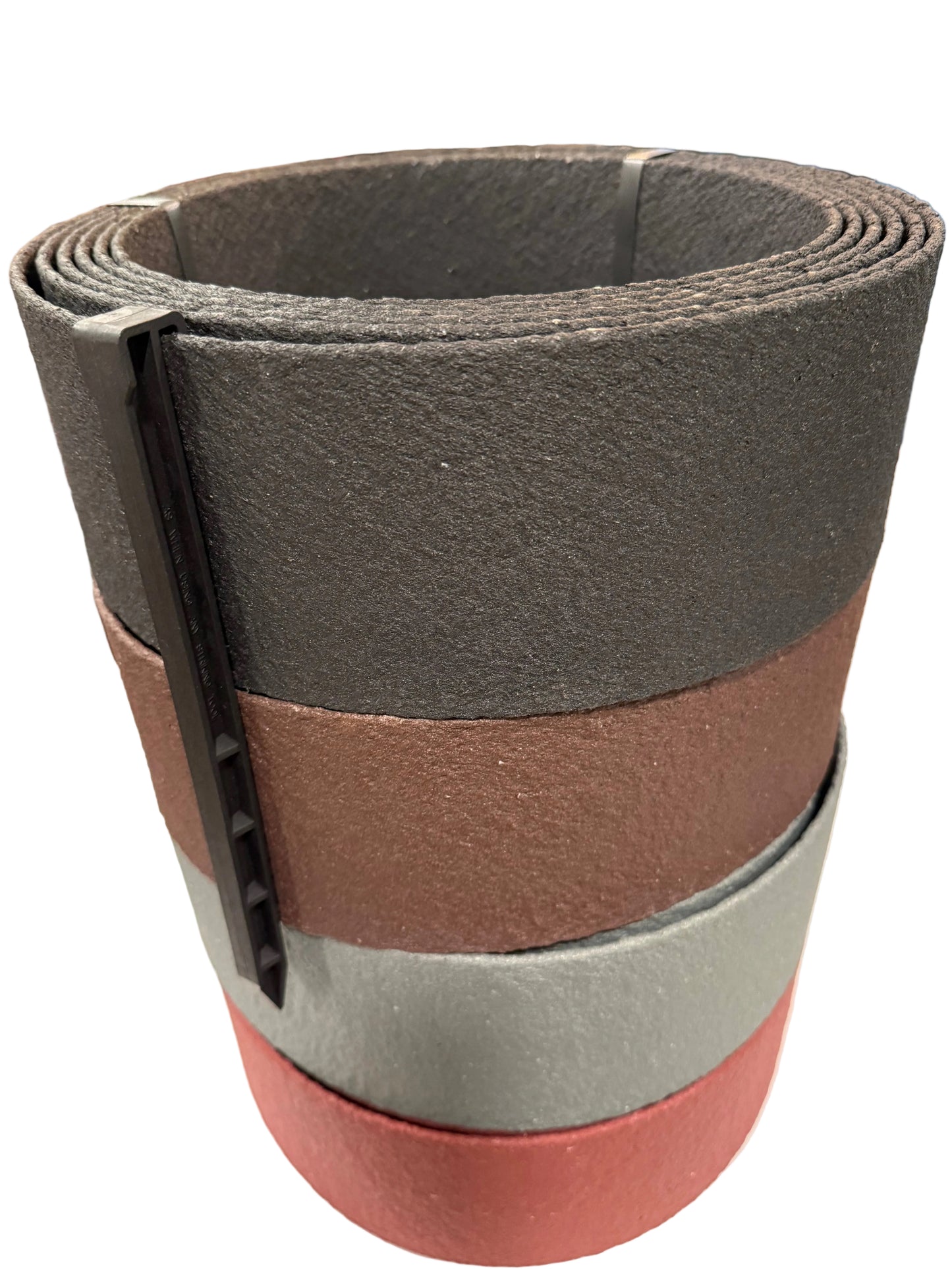 Coils of Thin Bender Board in all four colors: black, brown, natural, and redwood, with a J stake attached the to top left of the coil.