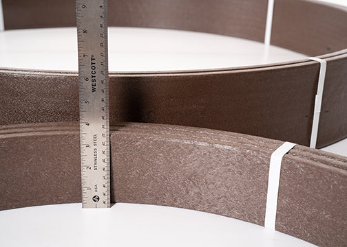 Brown bender board with a ruler to show the width