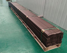 Brown bender boards sitting on a pallet 