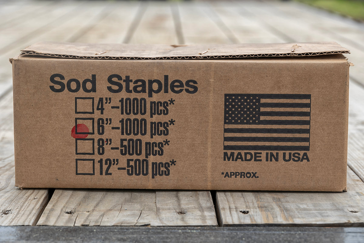 Image of a box of six-inch sod staples from Howell Pathways.